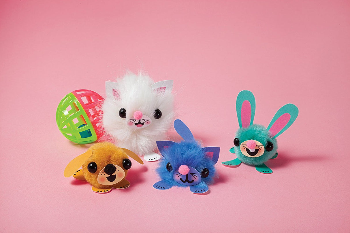 Jr My Pom Pom Pet Shop features four colorful fuzzy pom-pom pets with playful faces and accessories on a pink background.
