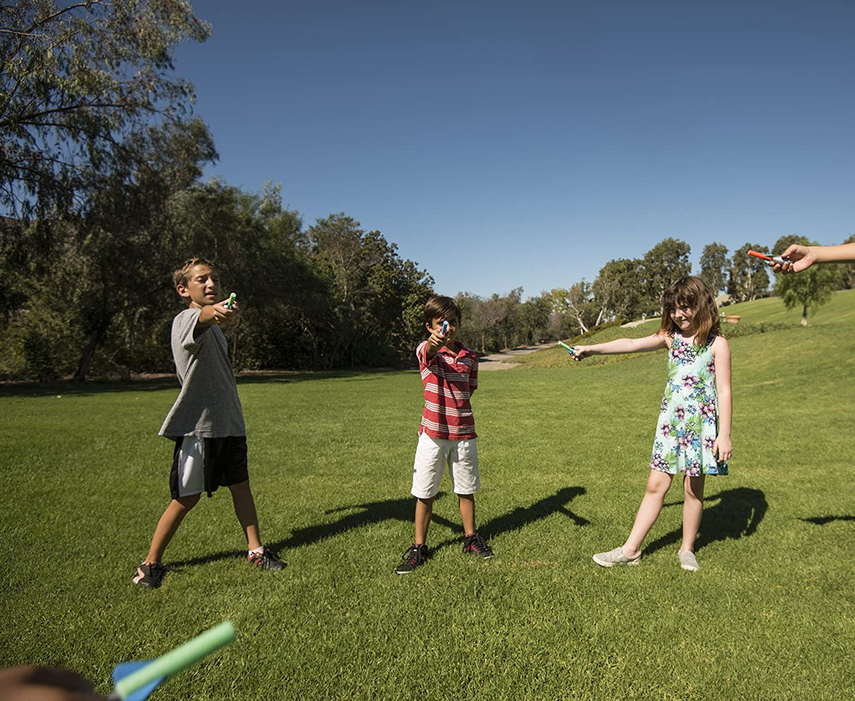 Kids outdoors aiming and launching colorful Squeeze Rockets, enjoying fun and flight with the Squeeze Rockets toy set.