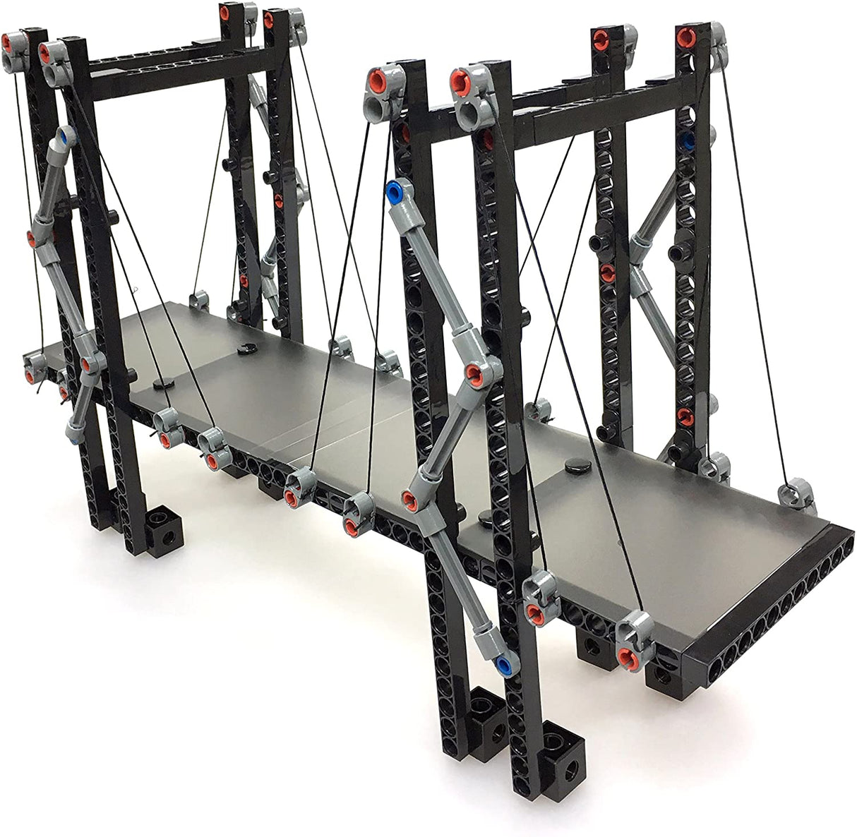 Structural Engineering kit model of a suspension bridge demonstrating basic structural principles and modular building pieces.