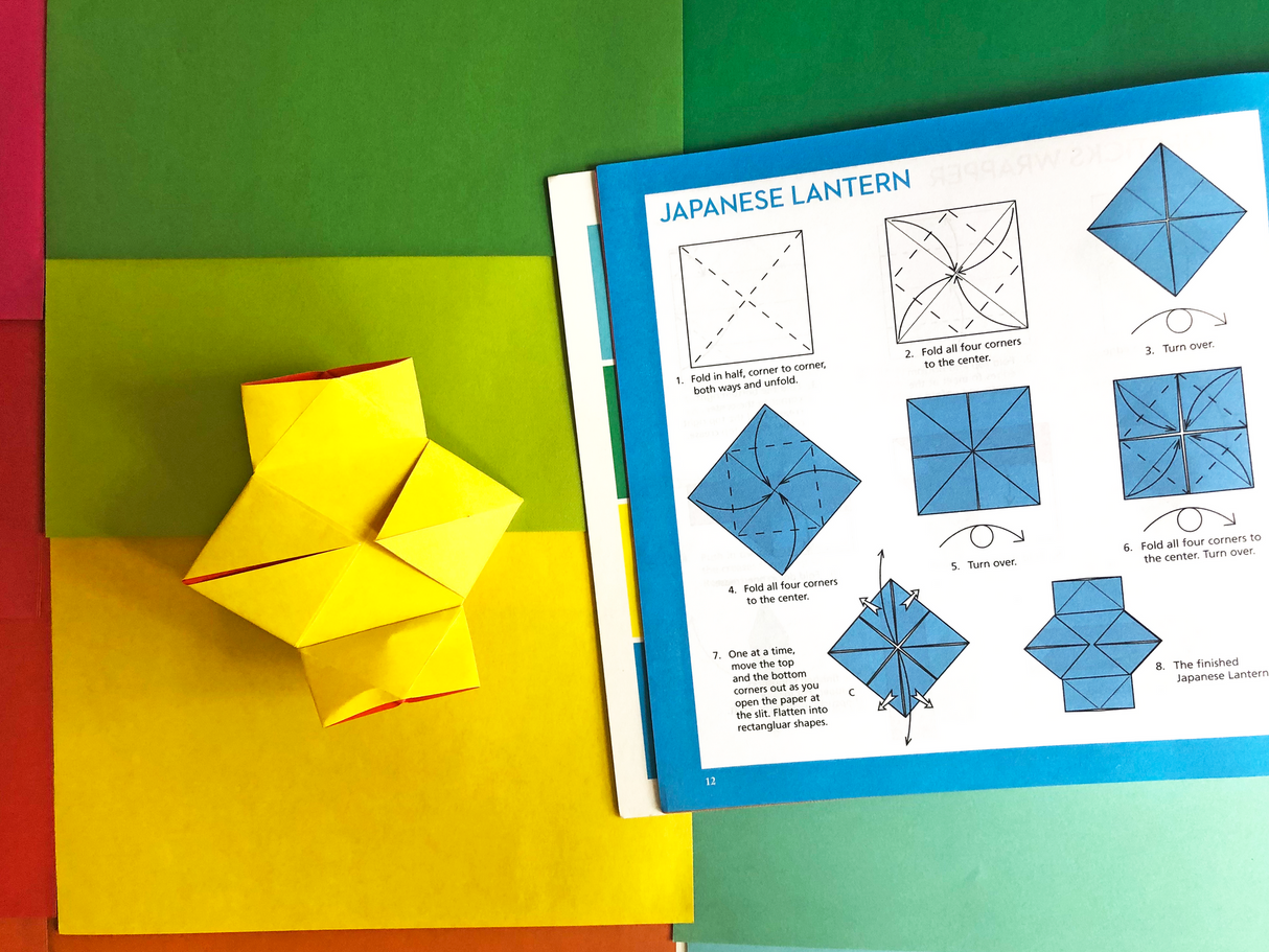 Origami Rainbow Paper Pack showcasing colorful sheets with Japanese lantern folding instructions and a finished yellow paper lantern.