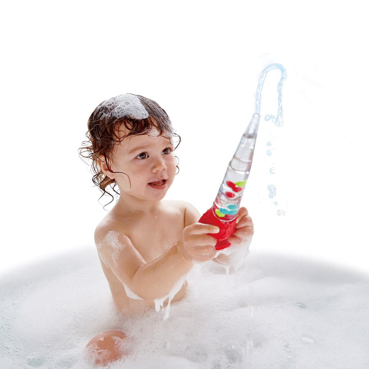 Child playing with Squeeze & Squirt bath toy, squirting water and enjoying bubbles during bath time fun.
