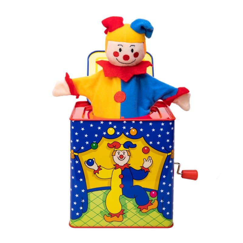 Jester Jack in the Box with colorful jester plush popping from classic metal box decorated with stars and juggler design.