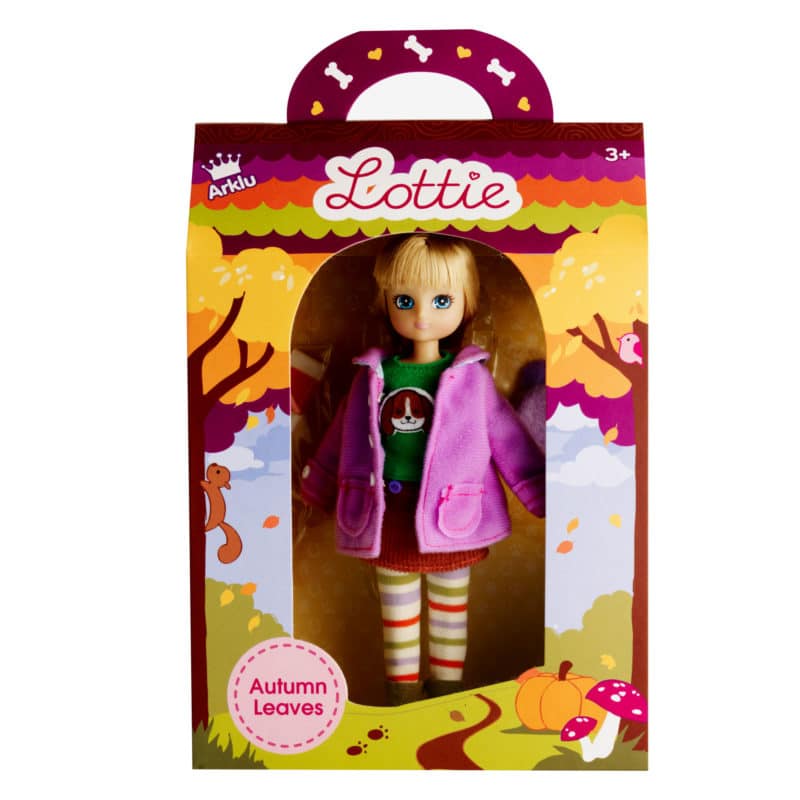 Lottie Autumn Doll in pink coat with striped leggings, blonde hair, blue eyes, autumn leaves packaging for ages 3+