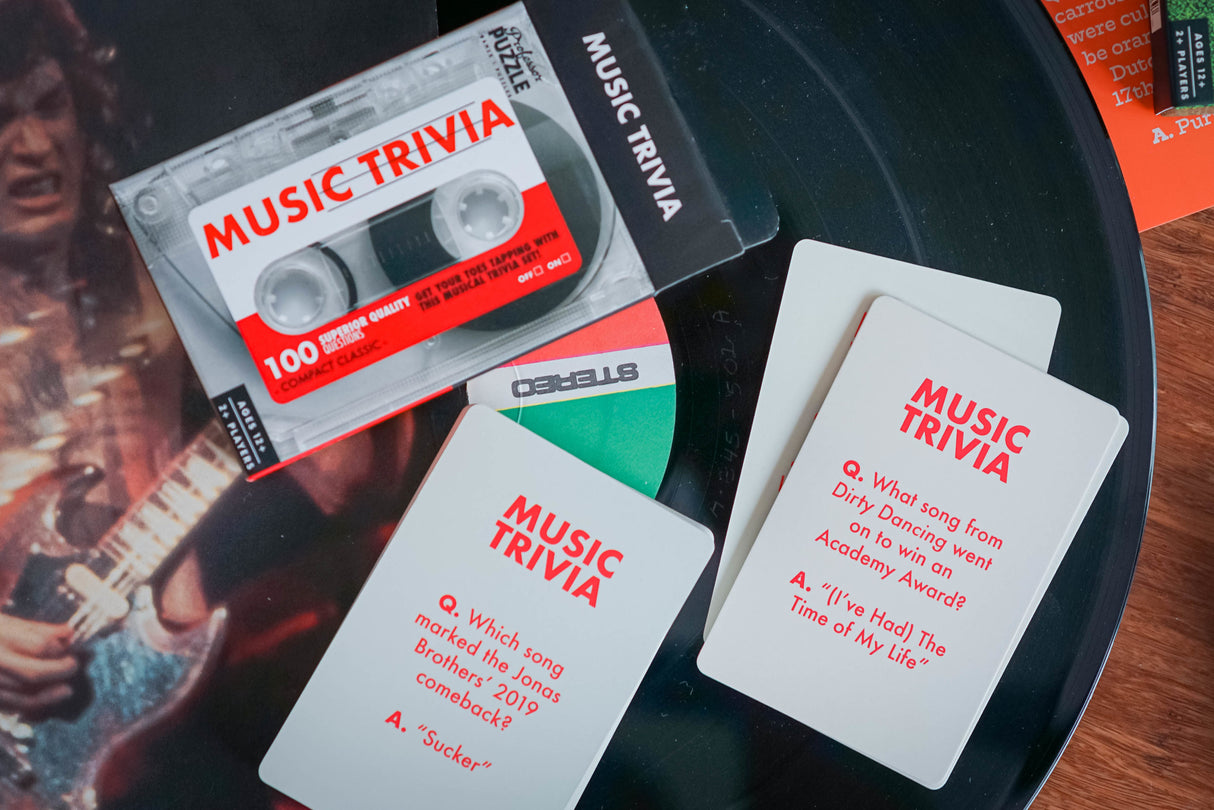 Mini Music Trivia game cards and packaging on a vinyl record, featuring music questions and answers.