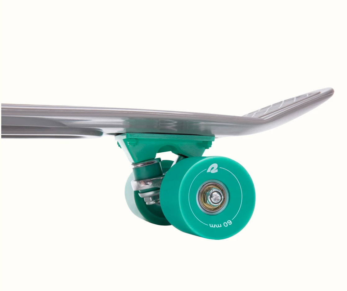 Quip Mini Cruiser Skateboard | Shark showing teal polyurethane wheels and lightweight flexible plastic deck close-up.