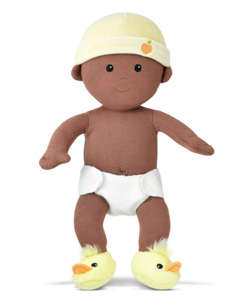 Organic Baby in Yellow wearing removable onesie, diaper, plush ducky booties, and yellow hat with Apple Park applique.