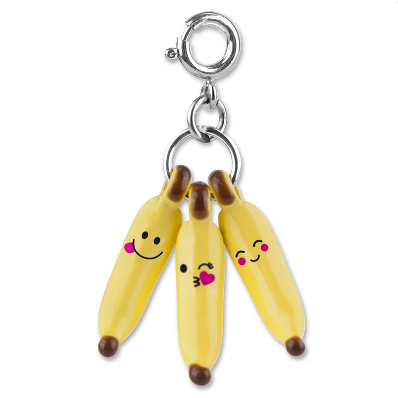 Banana-moji Charm with three yellow bananas featuring funny faces on a silver clasp for necklace or bracelet.
