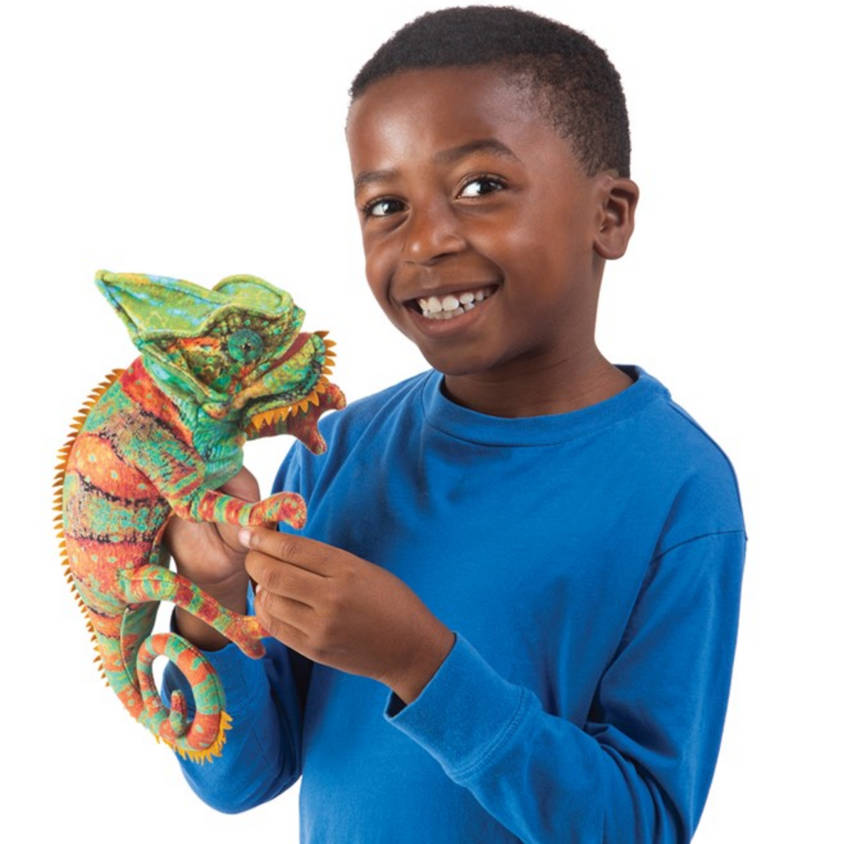 Child holding a colorful Folkmanis Small Chameleon Puppet with movable mouth and detailed design.