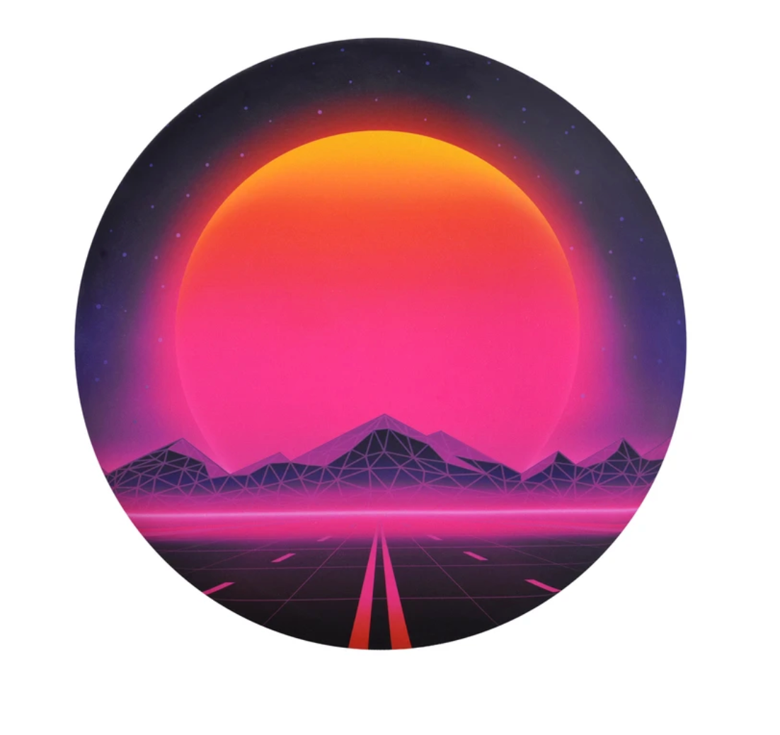 Waboba Wingman Disc with vibrant sunset and geometric mountain design flying straight over 130 feet, foldable silicone material.