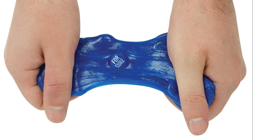 Hands stretching blue Trendsetters The Amazing Prediction Thinking Putty with visible truth stone inside.