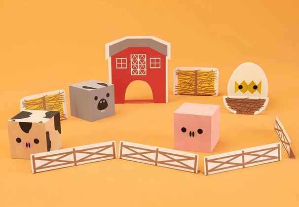 Cubelings Farm Blocks featuring sustainable wooden animal cubes, barn, fences, and farm-themed play pieces on orange background.