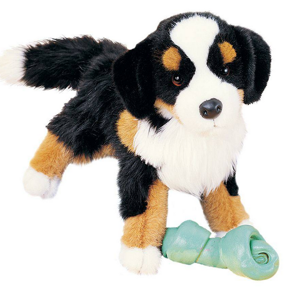 Bernese Mountain Dog Trevor plush toy with lifelike tri-colored fur and soulful brown eyes holding a green chew toy.