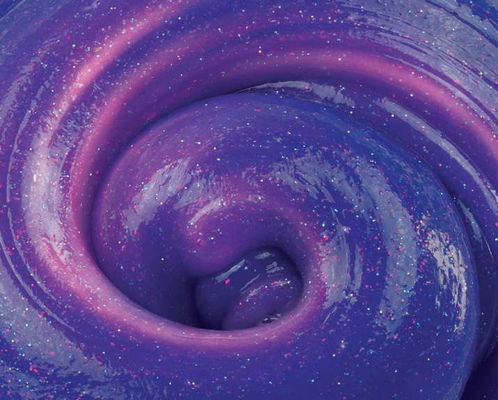 Close-up of swirled purple and pink shimmering texture of Trendsetters Intergalactic Thinking Putty changing colors.