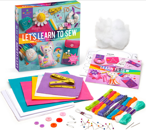 Let's Learn to Sew kit with colorful fabrics, thread, buttons, pins, measuring tape, stuffing, and full-color instruction booklet.