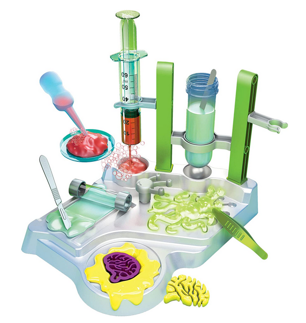 Ooze Labs Alien Slime Lab with tools like syringe, roller, scalpel, and tweezers for slime experiments and alien ooze research.