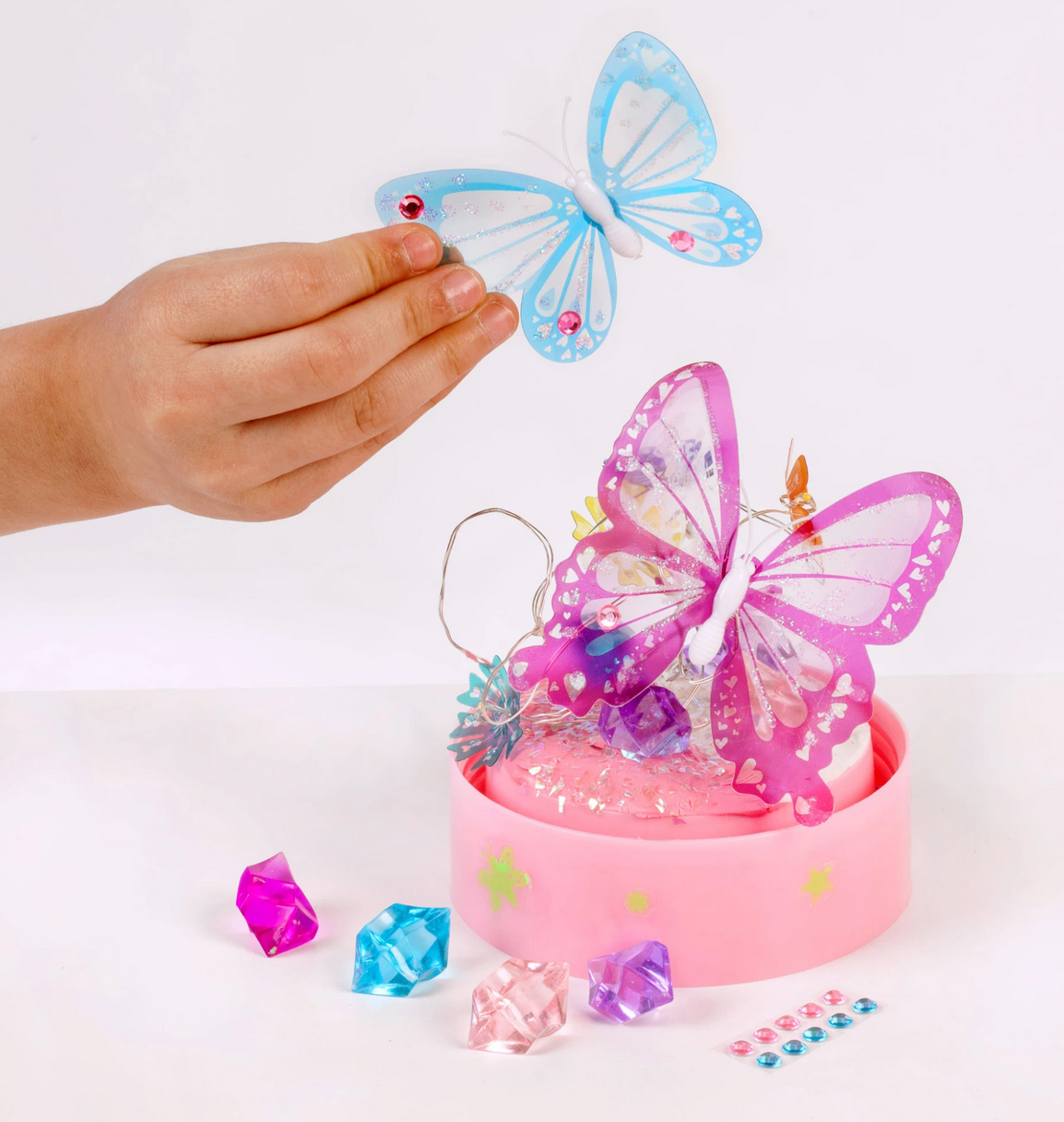 Butterfly Fairy Lights craft kit with translucent butterflies, colorful gemstones, and LED light-up base for creative décor.