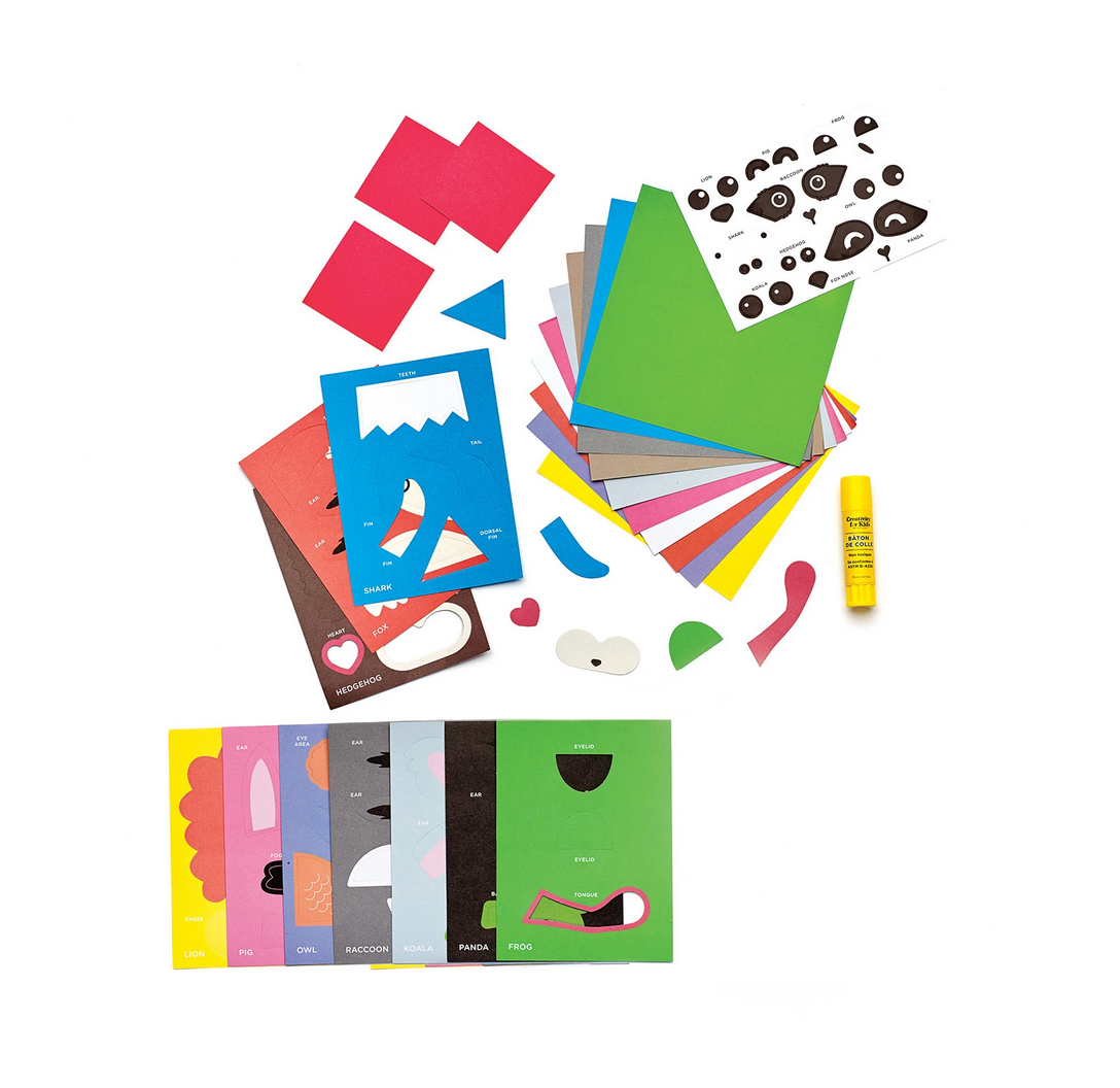 Corner Creature Bookmarks kit with colorful origami papers, animal face cutouts, glue stick, and step-by-step instructions.