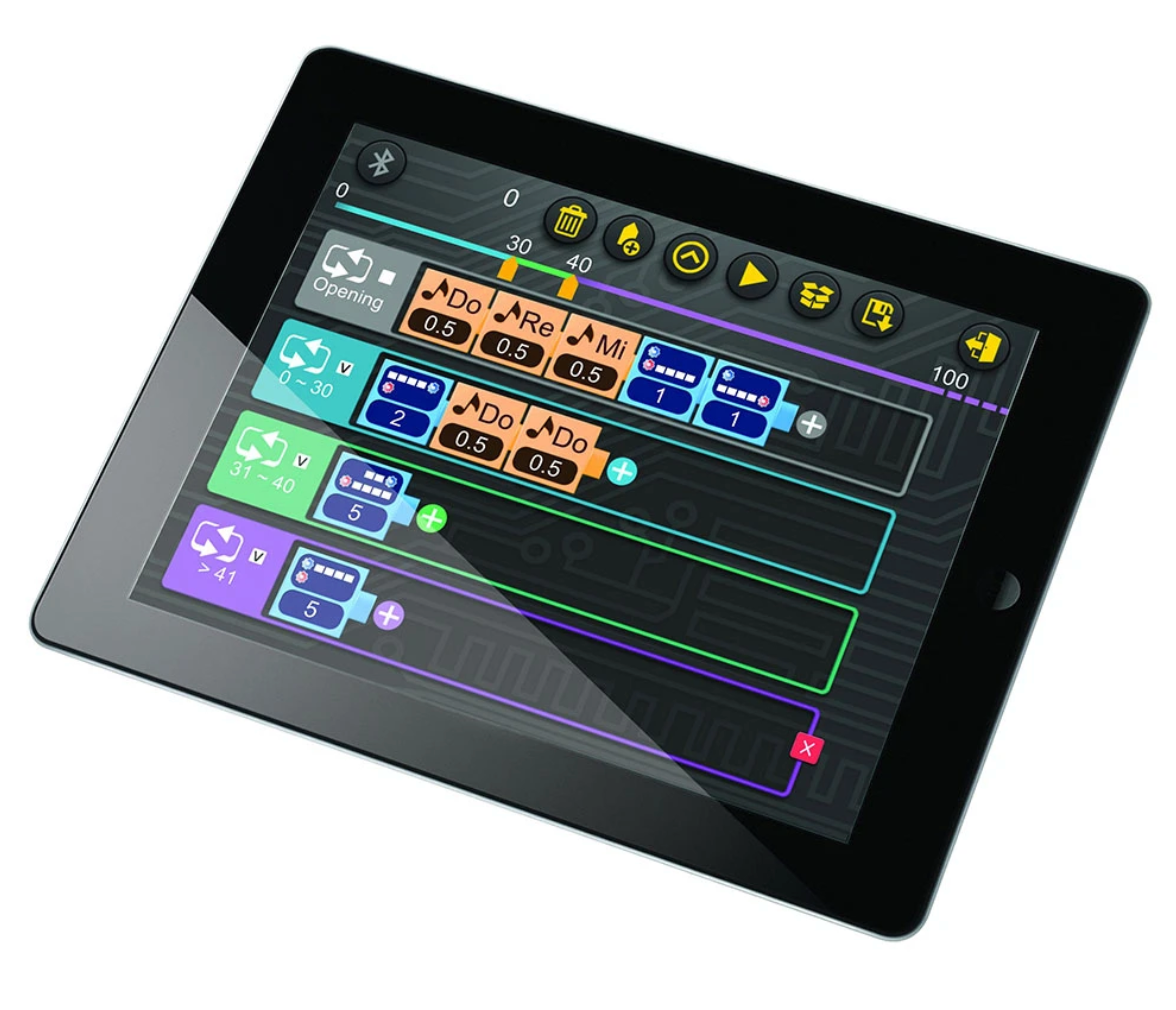 Tablet screen showing visual programming app interface for Robotics: Smart Machines kit.