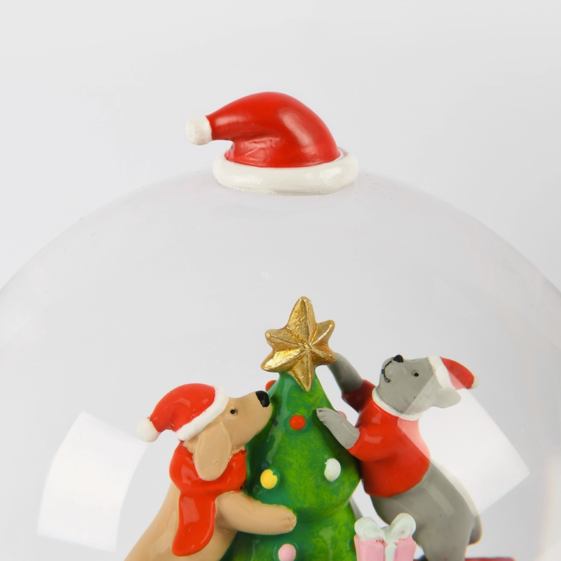 Cats & Dogs Snowglobe featuring hand-painted cats and dogs in Santa hats decorating a Christmas tree inside a glass dome.