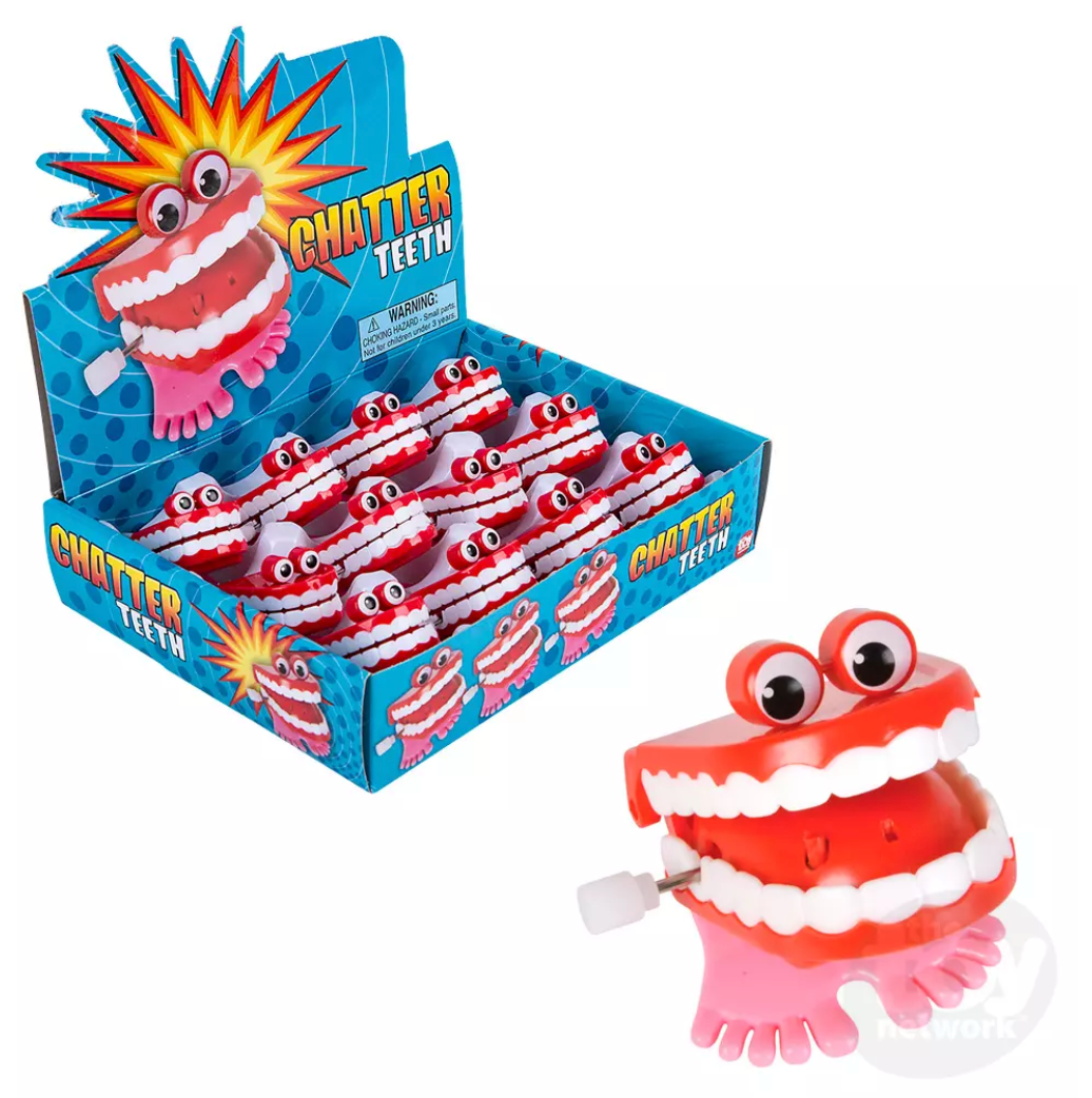 Chatter Teeth wind-up toy with big eyes and moving teeth, mini goofy fun measuring 2" tall by 1½" wide.