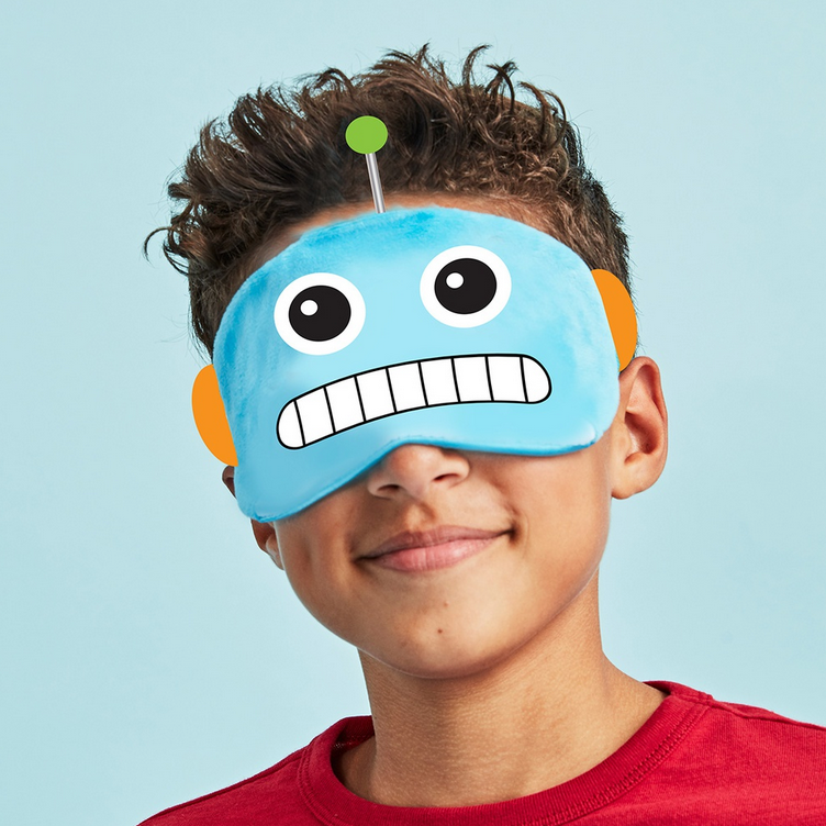 Boy wearing a soft fleece Eye Mask Robot with antennae and elastic strap against a blue background.