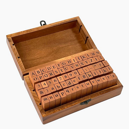 Letterpress Stamp Set in a rustic wooden box featuring vintage-style letters, numbers, and punctuation stamps.