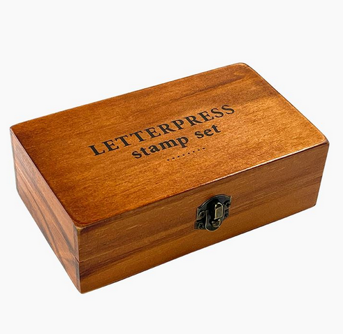 Rustic wooden box for Letterpress Stamp Set with metal clasp, perfect for storing 70 vintage-style stamps.