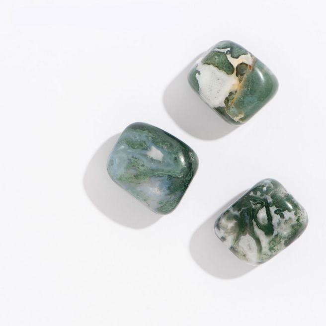 Rock | Tumbled Moss Agate stones with green, white, and black moss-like patterns, perfect for confidence and harmony.