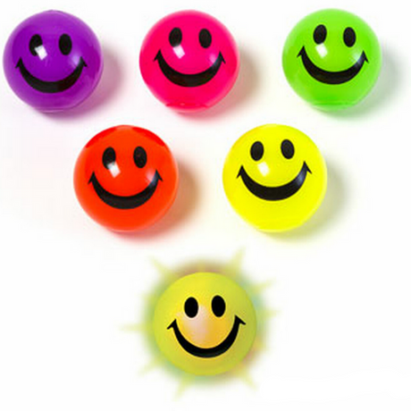 Bright assorted colored bouncy balls with smiling faces, featuring the Bouncy Ball | Light Up Smiley product.