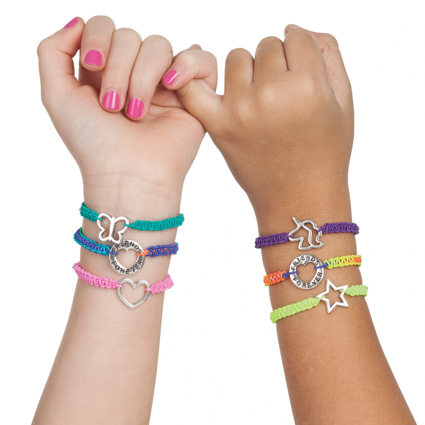 Hands wearing colorful DIY charm bracelets with silver charms linked by pinky fingers, Friends Forever Bracelets.