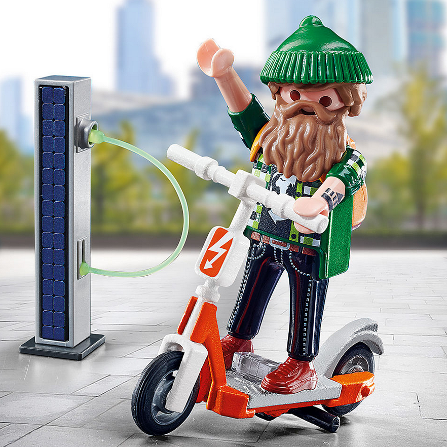 Special Plus | Man with E-Scooter Playmobil figure with beard, green hat, and orange charger in city setting on electric scooter.