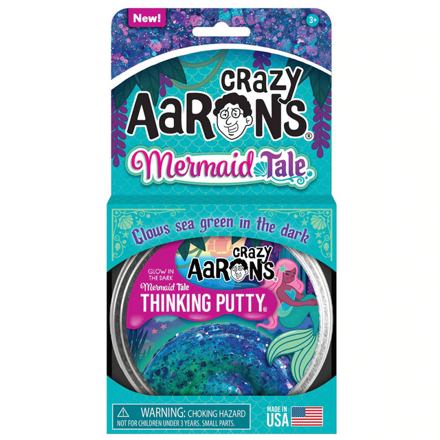 Glowbrights Mermaid Tail Thinking Putty in purple and turquoise shimmer glows sea green in the dark in a tin packaging.