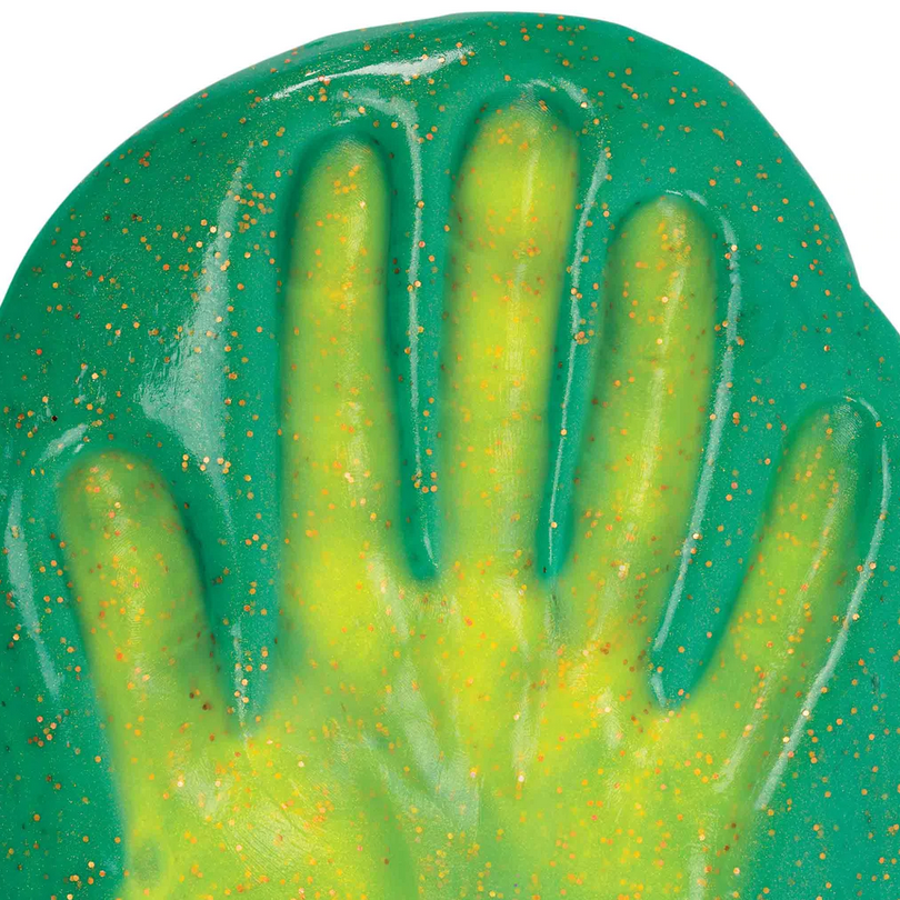 Hypercolors Magic Dragon Thinking Putty in green with bronze sparkles, showing heat-sensitive color change.