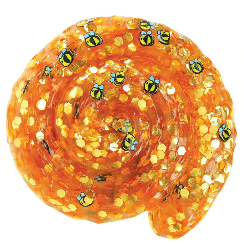 Trendsetters Honey Hive Thinking Putty with amber hues, honeycomb sparkles, and buzzing bee decorations in a swirl shape.