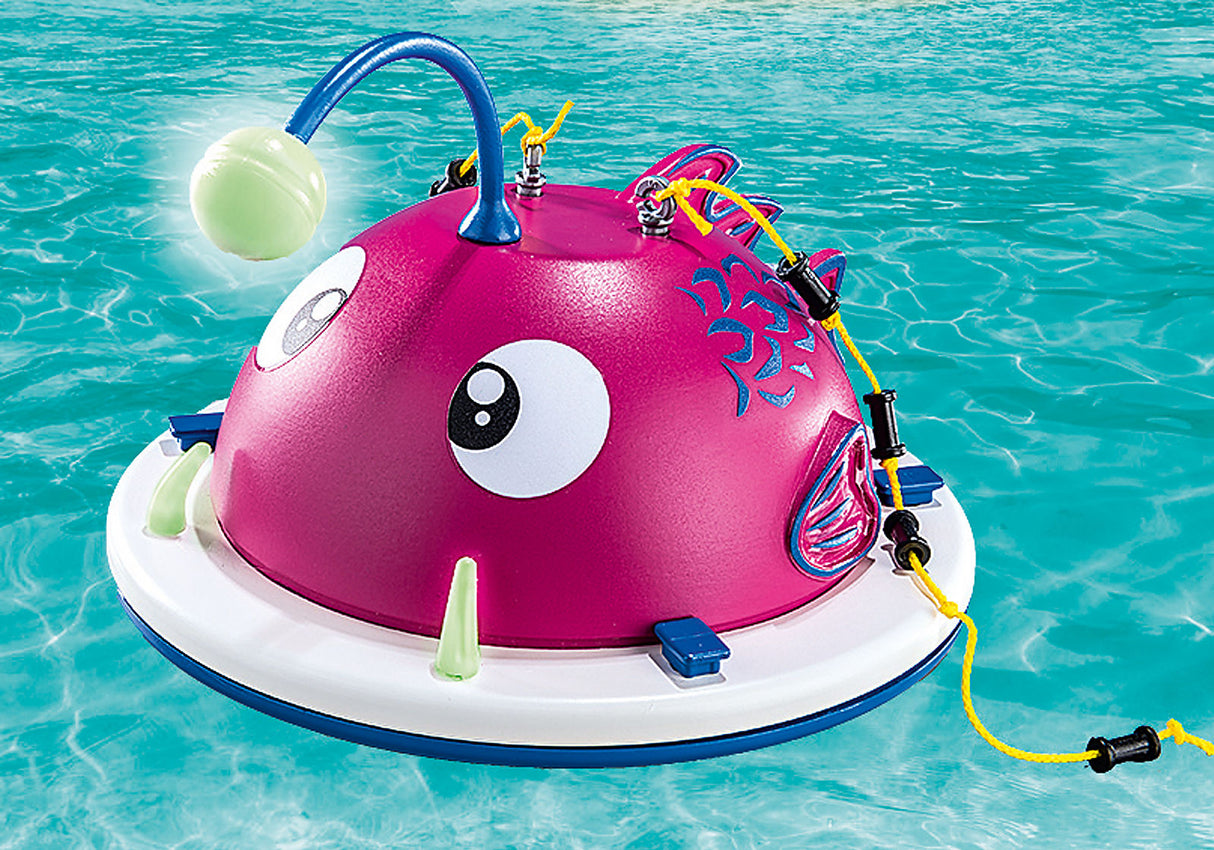 Family Fun | Swimming Island floating in pool water with glowing lantern and colorful climbing ropes attached.