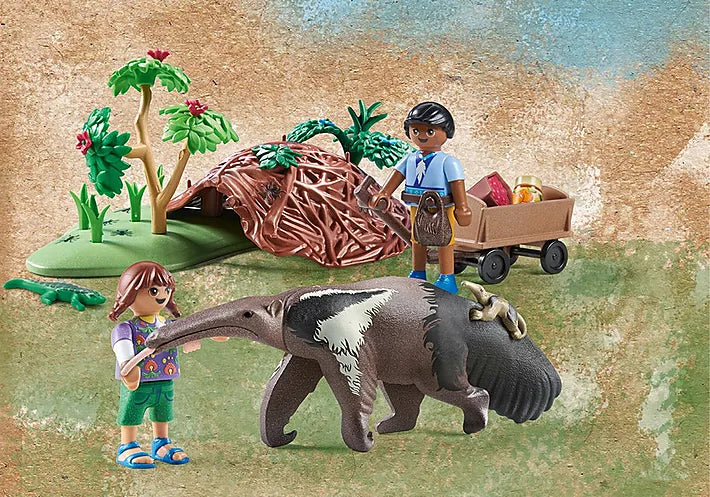 Wiltopia Anteater Care with two children figures, anteater with baby, anthill, plants, and handcart in natural setting.