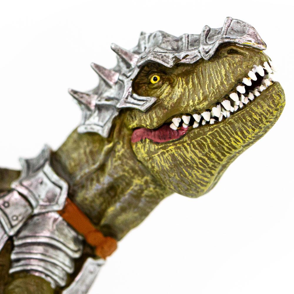 Close-up of Armored T-Rex toy featuring silver spiked armor and movable jaw with sharp teeth detail.