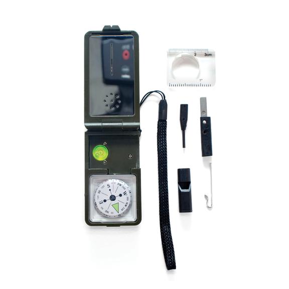 Camping Survival Tool with compass, whistle, magnifier, and fire starter flint for outdoor adventure and emergency use.