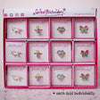 Rainbow Ring assorted styles including unicorn, star, heart, and butterfly designs in individual boxes for kids 3+.