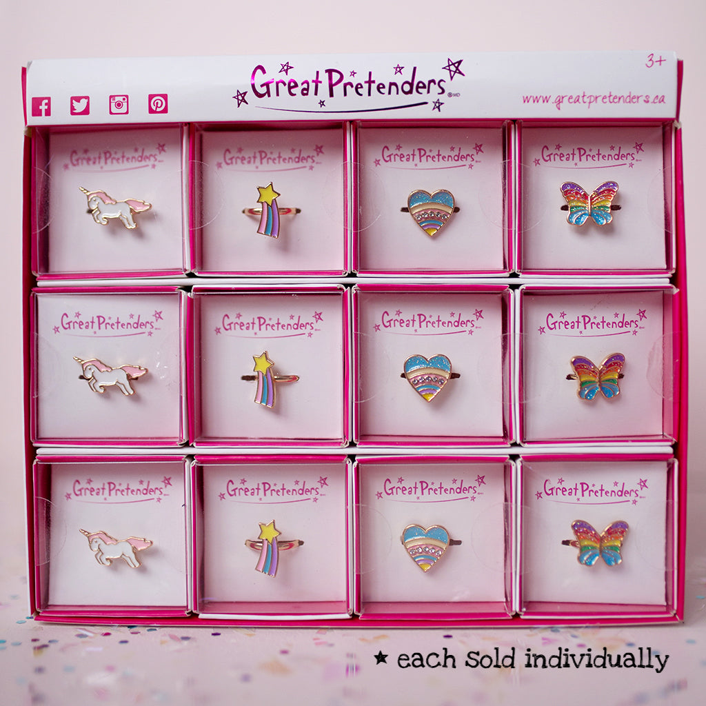 Rainbow Ring assorted styles including unicorn, star, heart, and butterfly designs in individual boxes for kids 3+.