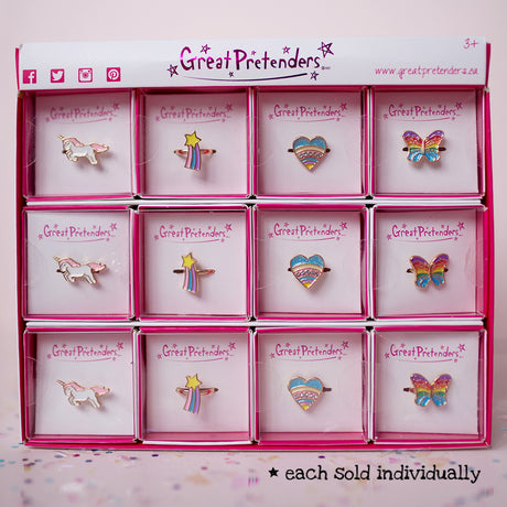Rainbow Ring assorted styles including unicorn, star, heart, and butterfly designs in individual boxes for kids 3+.