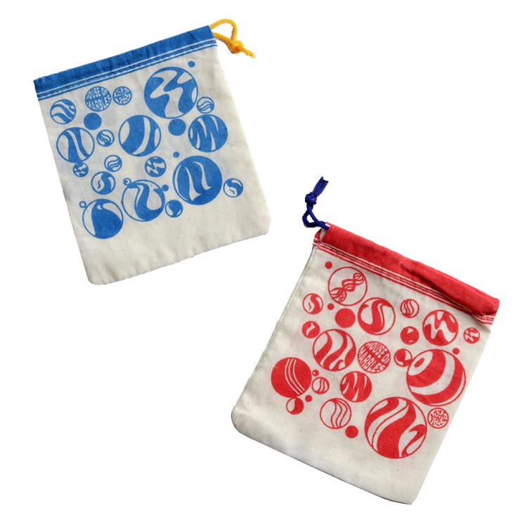 Cotton Marble Bag in blue and red with drawstring, designed to safely store marbles, measuring approximately 12 x 12 cm.