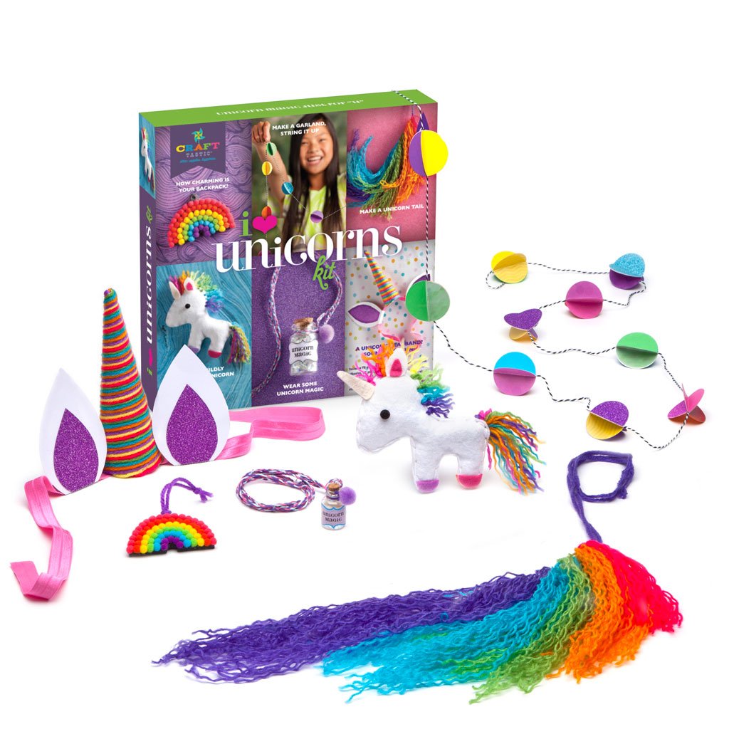 i <3 unicorns kit with colorful crafting supplies including headband, stuffie, garland, and unicorn magic dust.