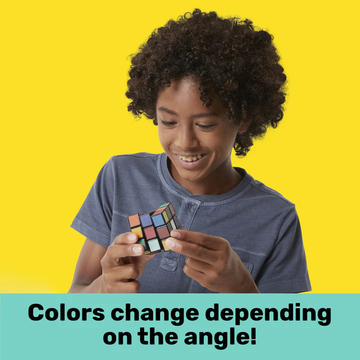 Child playing with the Rubiks 3x3 Impossible showing iridescent colors changing on the puzzle cube.