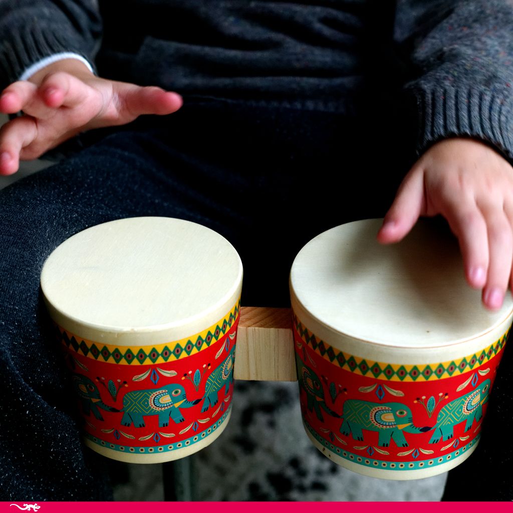 Child playing colorful Animambo Bongo Drums with vibrant elephant design, perfect for kids aged 3 and up.