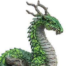 Jungle Dragon figurine with leaf-like green scales, tree trunk legs, and branch-like horns, standing about 5 inches tall.