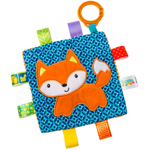 Taggies Crinkle Me Fox soft activity toy with colorful ribbons, crinkle paper, and squeaker for sensory play.
