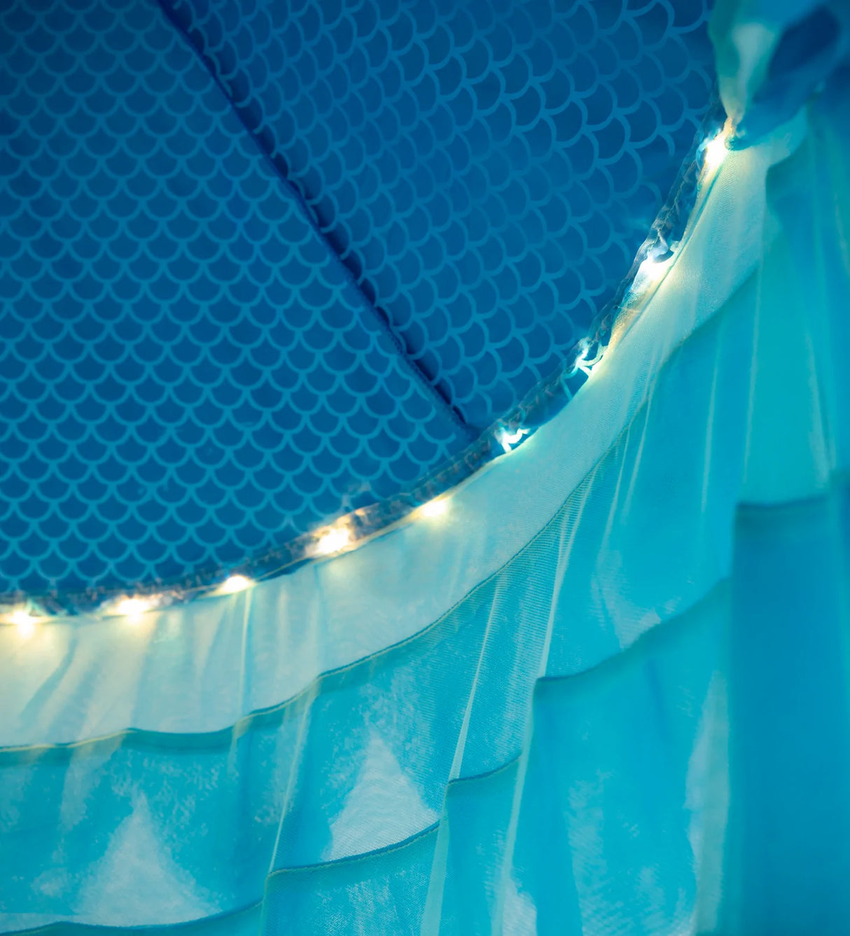 Light-Up Mermaid Canopy showing LED lights and iridescent blue scallop fabric detail inside the play canopy.