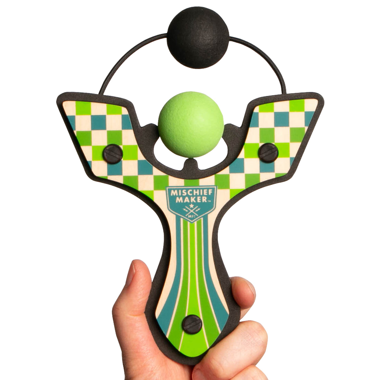 Hand holding the Slingshot Green Checkered with a green foam ball ready to shoot in a checkered wooden design.