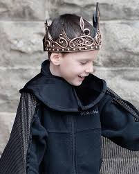 Medieval Crown | Gold/Black worn by child, flexible rubberized foam with black accents, adjustable with Velcro for comfort.